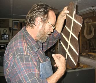 Oskar testing the back of a guitar